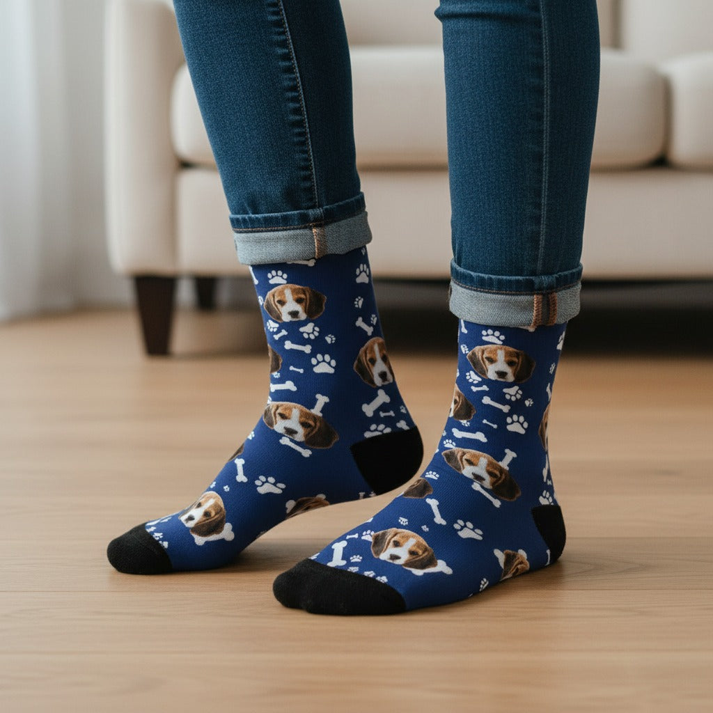 Navy blue custom dog socks with a beagle puppy face print, worn on real feet at home